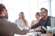 © ASDF - smiling businessman at a working meeting in the office