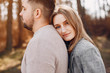 © prostooleh - Couple in a park. Blonde in a gray jacket. Man with a beard