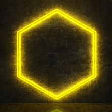 Yellow Neon Hexagon On Black Concrete Wall