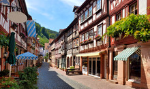 Beautiful Restaurant Lined Street Of Traditional Half Timbered Buildings In The Town Of Miltenberg, Bavaria, Germany