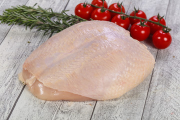 Raw chicken breast with skin