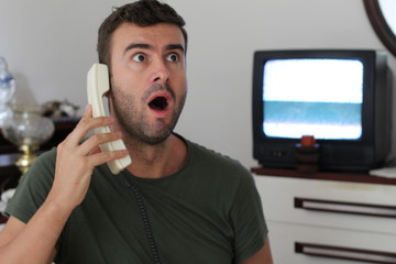 Retro styled image of man getting bad news through phone