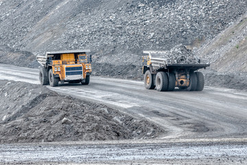 Wall Mural - Rock transportation by dump trucks.