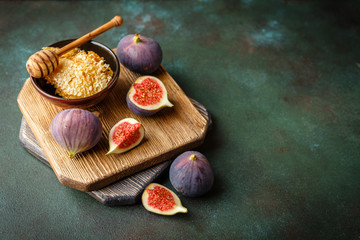 Sticker - Juicy fig fruits on a dark background