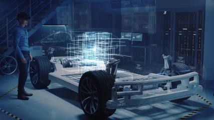 Leinwandbilder - Engineer Wearing Augmented Reality Headset Chooses Body for New Electric Car Concept. 3D Graphics Visualization Shows Vehicle Frame Developing in Real Time into Futuristic Concept
