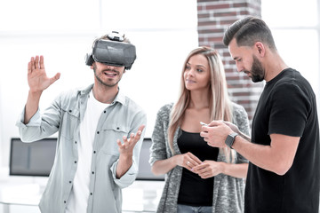 Positive colleagues testing virtual reality device