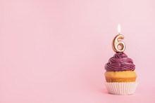 Birthday Cupcake With Number Six Candle On Pink Background, Space For Text