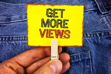 Poster - Word writing text Get More Views. Business concept for Increase web traffic optimise blog strategy analyse digitally written Yellow Sticky Note Paper holding by man with Clip Jeans background