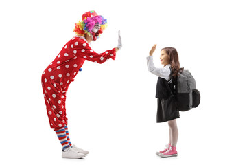 Sticker - Cheerful clown gesturing high-five with a schoolgirl