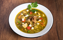 Peruvian Cilantro Chicken Soup Or Aguadito De Pollo With Yukon Gold Potatoes Corn On The Cob And Lime Slice