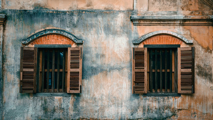 Sticker - Old cement wall with wood window background.