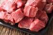 © Ildi - Fresh raw diced red beef meat on cast iron plate (Selective Focus)