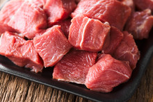 Fresh Raw Diced Red Beef Meat On Cast Iron Plate (Selective Focus)