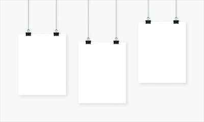 Set of three white realistic blank paper pages with shadow. Page hanging with bulldog clips