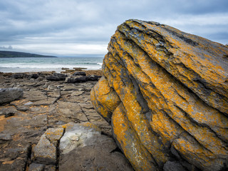 Massive rock on the coastline of Ireland Fanore beach