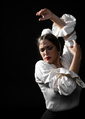 Front view flamenca raising hands in the air