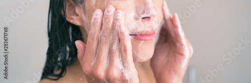 Cuadros en Lienzo Face wash exfoliation scrub soap woman washing scrubbing with skincare cleansing product panoramic banner