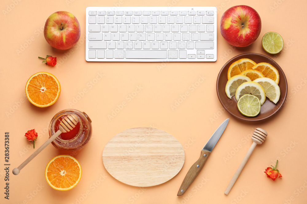 Computer keyboard with products and utensils on color background