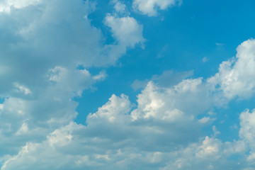 Blue sky with clouds on a bright sunny day