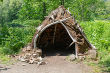 Hut Or Hovel Made Of Animal Skins And Bones. Reconstruction Of The Human Home Of The Stone Bronze Age.