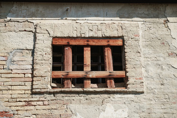Aufkleber - Old window of a brick building clogged with boards.