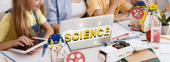 Poster - Group of kids studying on laptop with inscription Science