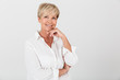 © Drobot Dean - Portrait closeup of happy adult woman with short blond hair smiling at camera