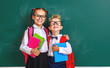 © JenkoAtaman - funny group children   schoolboy  and schoolgirl, student boy  and girl about school blackboard.