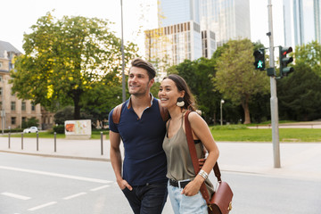 Sticker - Beautiful lovely young couple walking at the city streets