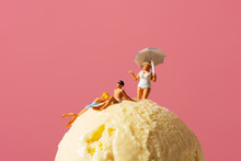 Miniature People In Swimsuit On An Ice Cream