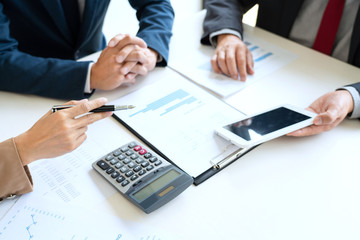 Business People Talking Discussing with coworker planning analyzing financial document data charts and graphs in Meeting and  successful teamwork Concept.