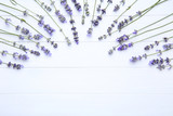 Fototapeta Lawenda - Lavender flowers on white wooden table