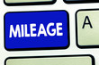 © Artur - Writing note showing Mileage. Business photo showcasing Number of miles travelled or covered Display panel Car instrument.