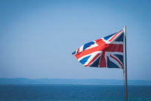 National Flag Of Great Britain At Sea