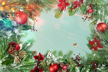 Wall Mural - christmas greenery and ornaments on green background
