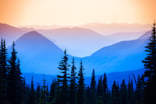 Hazy Scenic View Of Mountain Ranges In Mt. Rainier National Park.