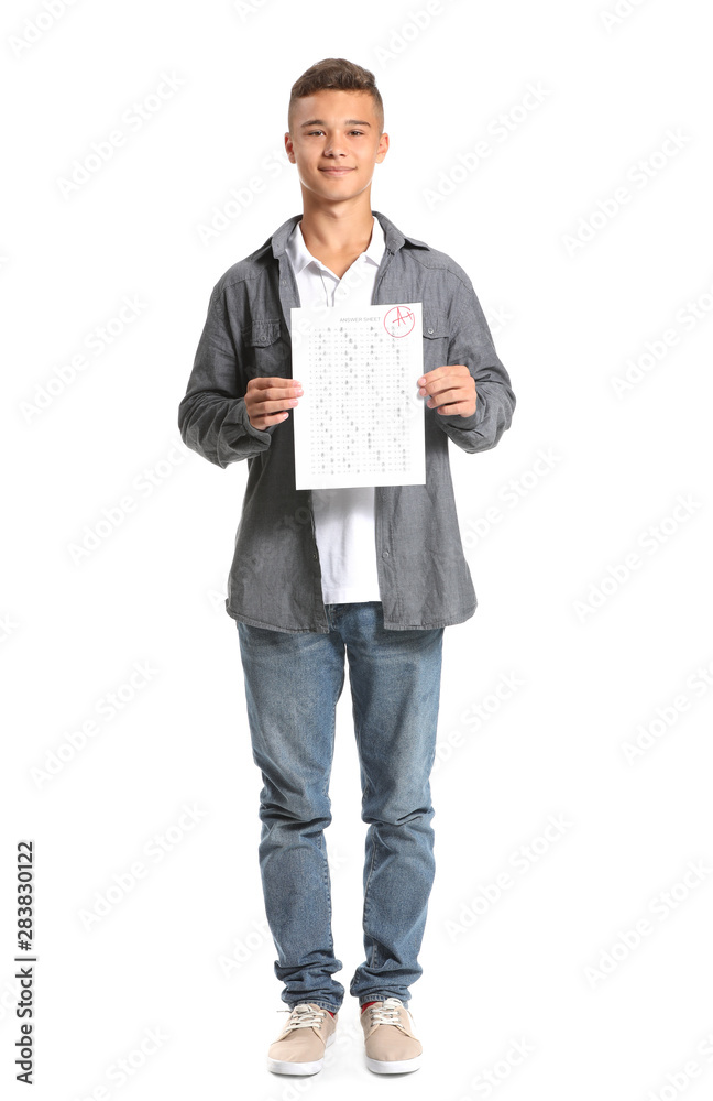 Happy boy with results of school test on white background