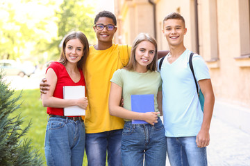 Wall Mural - Portrait of young students outdoors