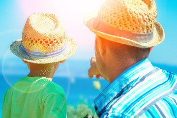 happy parent with child by the sea greece outdoors