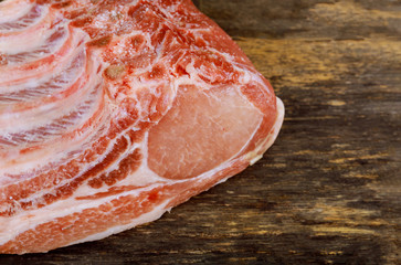 Wall Mural - Fresh raw pork loin with ribs on wooden board.