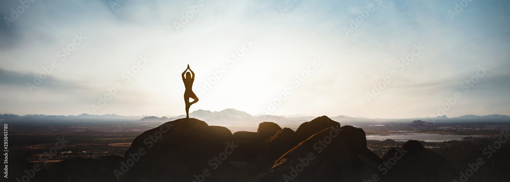 woman doing yoga on the mountain - obrazy, fototapety, plakaty 