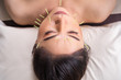 © geargodz - woman undergoing acupuncture treatment on face