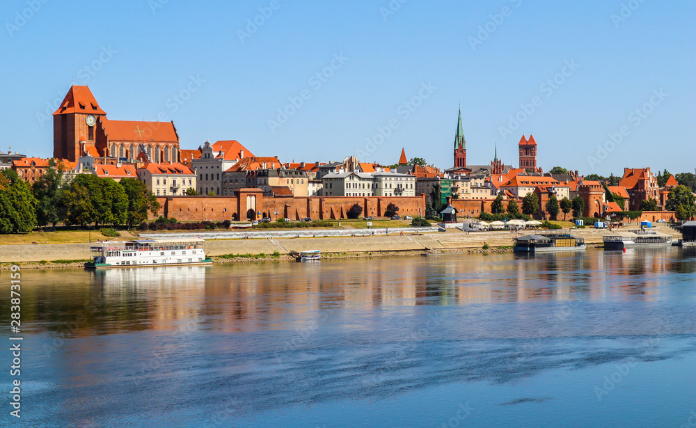 Obraz na płótnie Panoramic view of Torun city and Wisla (Vistula) river in sunny day. Poland, summer 2019 w salonie