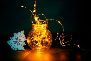 Wall Mural - garland in a bottle, christmas wallpaper concept. the warmth and comfort of home