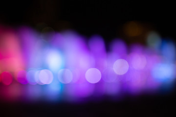 Fountain show with multicolor bokeh color light illumination abstract.