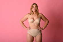 Attractive Chubby Girl In Underwear On Pink Background