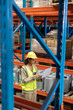 © WavebreakMediaMicro - Female worker working on laptop in warehouse