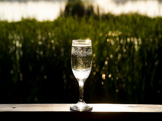 glass of white wine on background of  sky