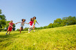 © Sergey Novikov - Crazy cute happy kids run in park holding hands