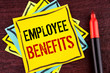 Handwriting text Employee Benefits. Concept meaning list of advantage recruiter get at work Insurance written Yellow Sticky note paper wooden background Marker next to it.